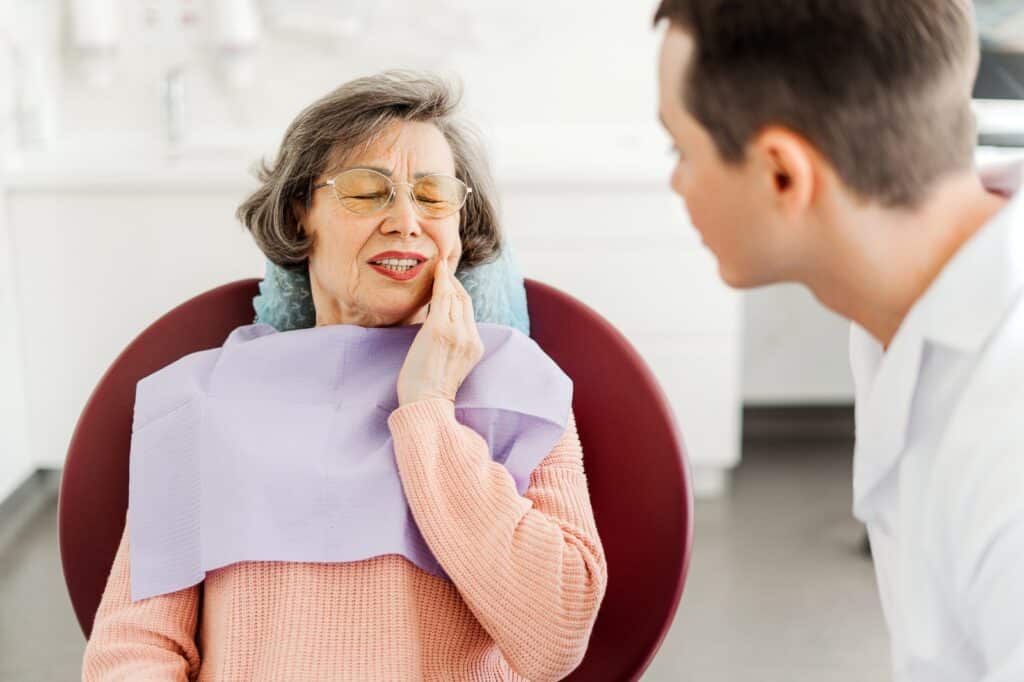 Dentist consulting with a patient about dental treatment options